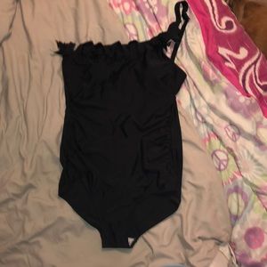 Black one piece swimsuit, off the shoulder